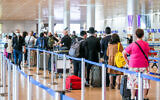 Passengers at the Ben Gurion Airport departure hall on December 14, 2020 (Yossi Aloni/Flash90)