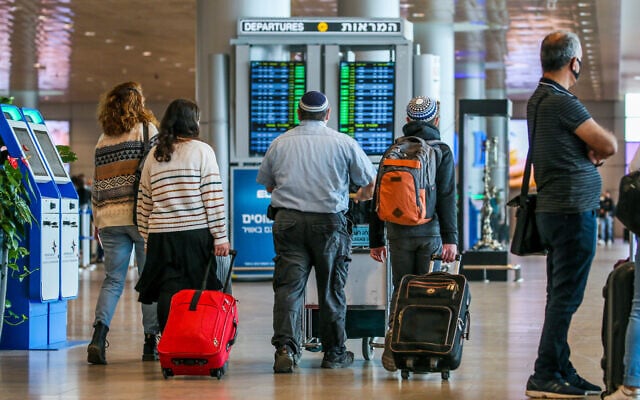 Travelers at the departure hall at Ben Gurion Airport on December 14, 2020. (Yossi Aloni/Flash90)