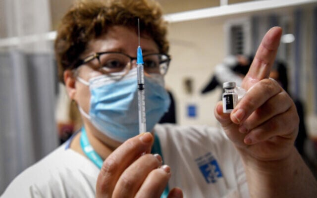 Teachers receive a COVID-19 vaccine, at the Shamir Medical Center in Be'er Ya'akov on December 30, 2020. (Avi Dishi/Flash90) Teachers receive a COVID-19 vaccine, at the Shamir Medical Center in Be'er Ya'akov on December 30, 2020. (Avi Dishi/Flash90)