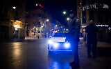 Israel Police offices patrol on Jaffa Street in Jerusalem on New Year's Eve, during the country's third lockdown due to the COVID-19 pandemic, December 31, 2020. (Yonatan Sindel/Flash90)