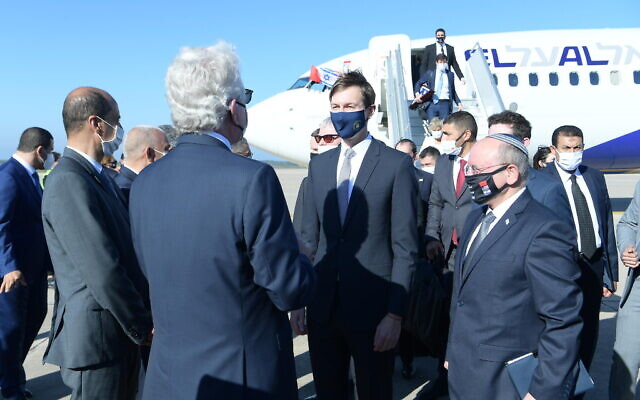 A joint Israel-US delegation, led by Meir Ben-Shabbat (right) and Jared Kushner (center) is greeted on landing in Rabat, after the first direct flight between Israel and Morocco, December 22, 2020 (Amos Ben-Gershom/GPO) A joint Israel-US delegation, led by Meir Ben-Shabbat (right) and Jared Kushner (center) is greeted on landing in Rabat, after the first direct flight between Israel and Morocco, December 22, 2020 (Amos Ben-Gershom/GPO)