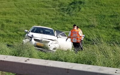 A car is seen by the roadside on Route 6 after it was shot at on December 28, 2020. One man died and another was critically injured in the suspected revenge attack (United Hatzalah)