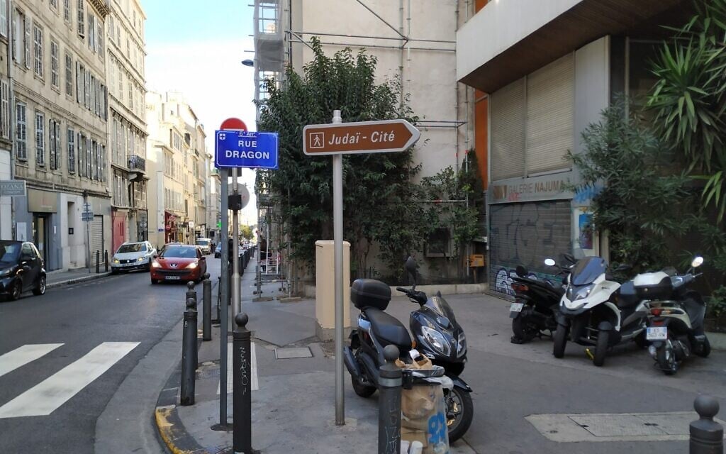 A sign points to Judai-Cite, or the Rue Saint-Suffren, a center for Jewish commerce in Marseille, October 2020. (Yaakov Schwartz/ Times of Israel)
