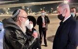 Then-prime minister Benjamin Netanyahu (R) greets released US spy-for-Israel Jonathan Pollard and his wife Esther at Ben Gurion Airport, December 30, 2020 (Courtesy)