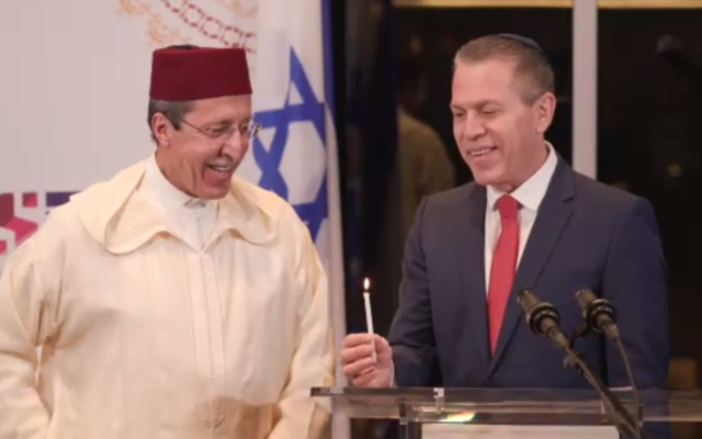 Morocco's Ambassador to the UN Omar Hilale lights Hanukkah candles with his Israeli counterpart Gilad Erdan in New York on December 17, 2020. (Screen capture/Zoom) Morocco's Ambassador to the UN Omar Hilale lights Hanukkah candles with his Israeli counterpart Gilad Erdan in New York on December 17, 2020. (Screen capture/Zoom)