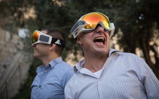 Illustrative: People take a view through augmented reality glasses as start-up firms showcase products at an Innovation Lab event at the Tower of David Museum in Jerusalem, October 17, 2017. (Hadas Parush/Flash90) Illustrative: People take a view through augmented reality glasses as start-up firms showcase products at an Innovation Lab event at the Tower of David Museum in Jerusalem, October 17, 2017. (Hadas Parush/Flash90)