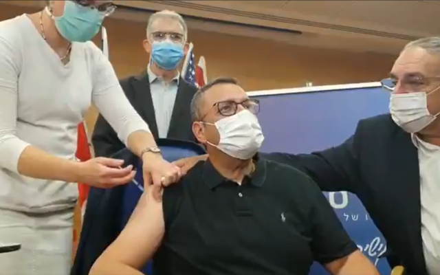 Jerusalem Mayor Moshe Lion, 59, gets a coronavirus vaccine at Hadassah Ein Kerem hospital in Jerusalem, December 20, 2020. (Screenshot/Twitter)