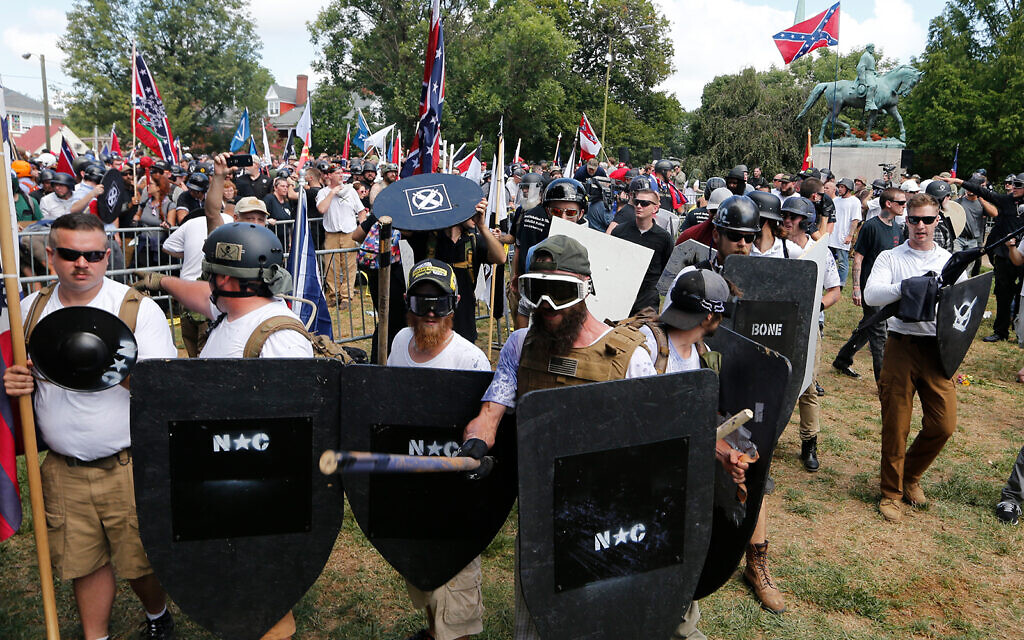 Illustrative: White nationalist demonstrators in Lee Park in Charlottesville, Virginia, August 12, 2017. (AP Photo/Steve Helber) Illustrative: White nationalist demonstrators in Lee Park in Charlottesville, Virginia, August 12, 2017. (AP Photo/Steve Helber)