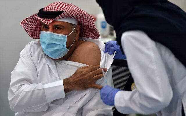 The first Saudi citizen to receive the Pfizer-BioNTech COVID-19 vaccine prepares for the shot in Riyadh, Saudi Arabia. (Fayez Nureldine/AFP) The first Saudi citizen to receive the Pfizer-BioNTech COVID-19 vaccine prepares for the shot in Riyadh, Saudi Arabia. (Fayez Nureldine/AFP)