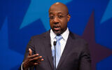 Democratic challenger for US Senate Raphael Warnock speaks during a debate with Republican US Senator Kelly Loeffler in Atlanta, December 6, 2020. (AP Photo/Ben Gray, Pool)