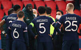 Istanbul Basaksehir's French forward Demba Ba (L) talks to a referee after a game was suspended amid allegations of racism by one of the match officials during a UEFA Champions League game between Paris Saint-Germain (PSG) and Istanbul Basaksehir FK in Paris, December 8, 2020. (Franck Fife/AFP)
