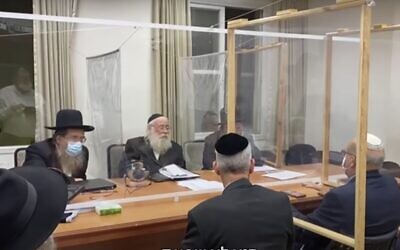 Screen capture from video of a meeting between health officials and lead ultra-Orthodox rabbis in the city of Bnei Brak aimed at encouraging coronavirus vaccination in the local community. (YouTube)