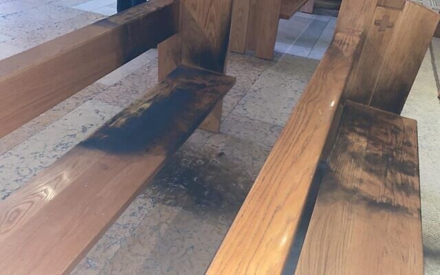 Burned benches in the Church of All Nations in East Jerusalem, where arson allegedly took place on Friday December 4, 2020 (Courtesy: Israel Police) Burned benches in the Church of All Nations in East Jerusalem, where arson allegedly took place on Friday December 4, 2020 (Courtesy: Israel Police)