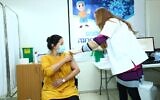 A Jerusalem woman receives a COVID-19 vaccine at a center run by the Clalit healthcare provider (courtesy of Clalit)