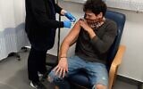 A volunteer in the Phase 2 trial for Israel's coronavirus vaccine, BriLife, at Sheba Medical Center, on December 28, 2020 (courtesy of Sheba Medical Center)