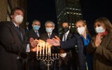 (From L-R) East End Temple Rabbi Joshua Stanton, Israel New York Acting Consul General Israel Nitzan, JCRC-NY CEO Michael Miller, UAE New York Consul General Abdalla Shaheen, Cordoba House executive director Naz Ahmed Georga and Manhattan Borough president Gayle Brewer light Hanukkah candles in Manhattan on December 14, 2020. (Shahar Azran)