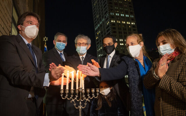 (From L-R) East End Temple Rabbi Joshua Stanton, Israel New York Acting Consul General Israel Nitzan, JCRC-NY CEO Michael Miller, UAE New York Consul General Abdalla Shaheen, Cordoba House executive director Naz Ahmed Georga and Manhattan Borough president Gayle Brewer light Hanukkah candles in Manhattan on December 14, 2020. (Shahar Azran) (From L-R) East End Temple Rabbi Joshua Stanton, Israel New York Acting Consul General Israel Nitzan, JCRC-NY CEO Michael Miller, UAE New York Consul General Abdalla Shaheen, Cordoba House executive director Naz Ahmed Georga and Manhattan Borough president Gayle Brewer light Hanukkah candles in Manhattan on December 14, 2020. (Shahar Azran)