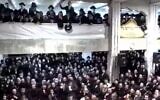 Members of the Pnei Menachem community in Jerusalem celebrate Hanukkah without adhering to coronavirus restrictions, December 17, 2020 (video screenshot)