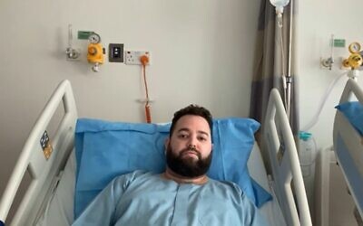 Screen capture from video of Liran Landau, an Israeli tourist injured in a car accident in Dubai, as he speaks with Channel 12 news, December 13, 2020 (Screen grab)