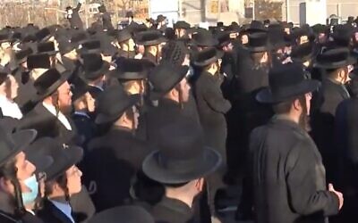 Thousands of ultra-Orthodox Jews defy coronavirus restrictions to attend a funeral for Rabbi Yisroel Chaim Menashe Friedman,  a longtime judge of the Satmar rabbinic court in Brooklyn on  December 7, 2020 (Screencapture/New York Post)