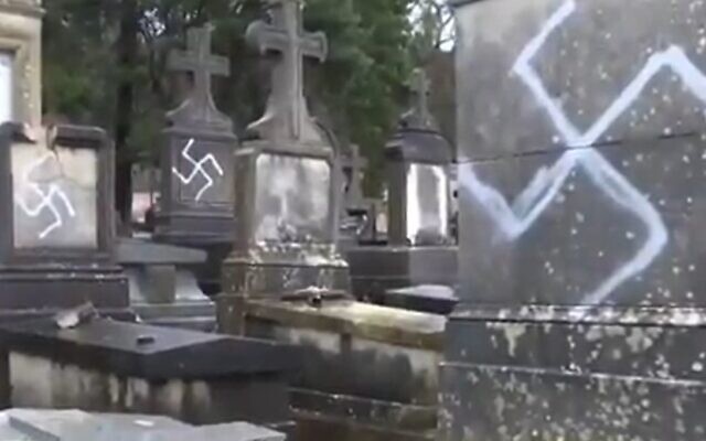 Graves defaced with swastikas in the French town of Fontainebleau, December 28, 2020 (Screen grab/BFM) Graves defaced with swastikas in the French town of Fontainebleau, December 28, 2020 (Screen grab/BFM)