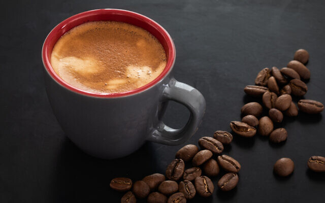 Illustrative image of a cup of coffee against the background of roasted coffee beans (Lenti Hill; iStock by Getty Images) Illustrative image of a cup of coffee against the background of roasted coffee beans (Lenti Hill; iStock by Getty Images)