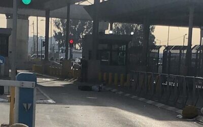 A Palestinian man lies on the ground after he was shot for failing to listen to security guards at the Qalandiya checkpoint and approaching them in a suspicious way on December 7, 2020. (Courtesy)