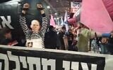 A man dressed as Prime Minister Benjamin Netanyahu in chains and a prison uniform standing in front of an inflatable submarine at a march between the Tel Aviv suburbs of Ramat Gan and Givatayim on Thursday, December 4, 2020. (Screengrab: Twitter)