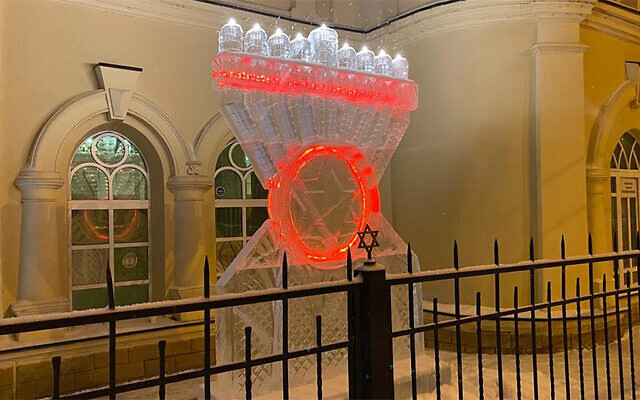 Snow falls on a Hanukkah menorah made of ice in Tomsk, Russia on December 8, 2020. (Levy Kaminetsky via JTA) Snow falls on a Hanukkah menorah made of ice in Tomsk, Russia on December 8, 2020. (Levy Kaminetsky via JTA)