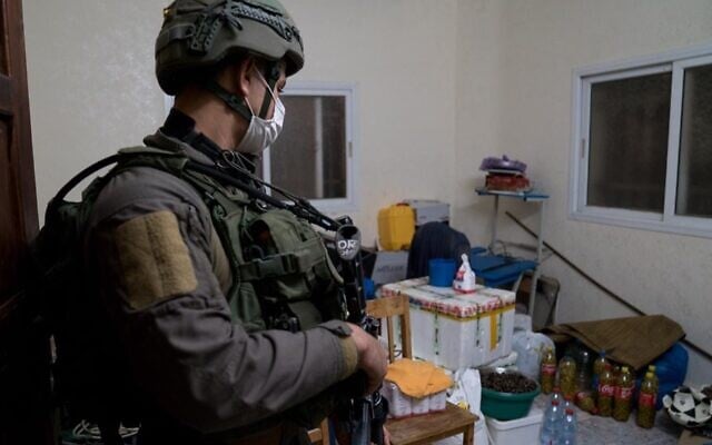 A photo released by the Israel Defense Forces on December 23, 2020, shows a soldier in the West Bank village of Qabatiya, during a raid of the home of Ahmad Abu al-Rabb. (Israel Defense Forces) A photo released by the Israel Defense Forces on December 23, 2020, shows a soldier in the West Bank village of Qabatiya, during a raid of the home of Ahmad Abu al-Rabb. (Israel Defense Forces)