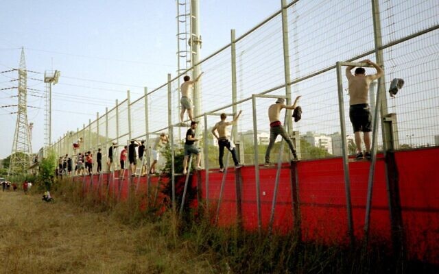 Yuval Daniel Ohadi's photo of Hapoel Tel Aviv soccer fans watching a practice during the coronavirus, part of the 'Local Testimony' photo exhibit, opening December 24, 2020 in Tel Aviv (Courtesy 'Local Testimony')