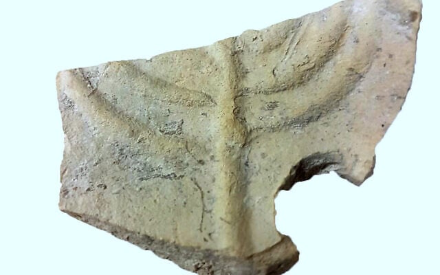 Lamp fragment with menorah symbol found at the the Beit Nattif excavation in Beit Shemesh (Moran Balila, Israel Antiquities Authority) Lamp fragment with menorah symbol found at the the Beit Nattif excavation in Beit Shemesh (Moran Balila, Israel Antiquities Authority)