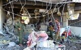Fighters with the Saudi-backed coalition assess the damage inside the airport of Yemen's southern city of Aden on December 31, 2020, a day after explosions rocked the building, killing or injuring dozens of people. (Saleh Al-OBEIDI / AFP)