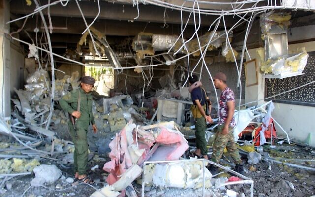 Fighters with the Saudi-backed coalition assess the damage inside the airport of Yemen's southern city of Aden on December 31, 2020, a day after explosions rocked the building, killing or injuring dozens of people. (Saleh Al-OBEIDI / AFP) Fighters with the Saudi-backed coalition assess the damage inside the airport of Yemen's southern city of Aden on December 31, 2020, a day after explosions rocked the building, killing or injuring dozens of people. (Saleh Al-OBEIDI / AFP)