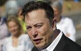 Tesla CEO Elon Musk speaks to media as he arrives to visit a construction site in Gruenheide, near Berlin, September 3, 2020. (Odd Andersen/AFP)