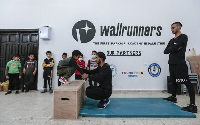 Palestinian Parkour enthusiasts exercise in a training facility in Gaza City, December 28, 2020. (AFP)