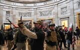 Supporters of US President Donald Trump enter the US Capitol's Rotunda on January 6, 2021, in Washington, DC. (Saul Loeb/AFP)