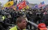 Trump supporters clash with police and security forces as they try to storm the US Capitol, in Washington on January 6, 2021. (Joseph Prezioso/AFP)