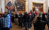 Supporters of US President Donald Trump protest in the US Capitol Rotunda on January 6, 2021, in Washington, DC. - Demonstrators breeched security and entered the Capitol as Congress debated the a 2020 presidential election Electoral Vote Certification. (SAUL LOEB / AFP)