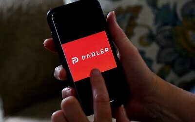 This illustrative photo taken on July 2, 2020 shows social media application logo Parler displayed on a smartphone in Arlington, Virginia (Olivier DOULIERY / AFP)