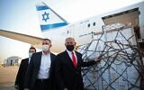 Prime Minister Benjamin Netanyahu (R) and Health Minister Yuli Edelstein (C) attend a ceremony for the arrival of a plane carrying a shipment of Pfizer-BioNTech anti-coronavirus vaccine, at Ben Gurion Airport near the Israeli city of Tel Aviv on January 10, 2021. (Motti Millrod/Pool/AFP)