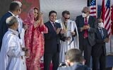 Moroccan Foreign Minister Nasser Bourita (C) and David Schenker, US Assistant Secretary of State for Near Eastern Affairs - who is wearing a traditional dress for men called 'Darraa' - (center-R) pose with other officials for a picture after their meeting in Dakhla, in Morocco-administered Western Sahara, on January 10, 2021. (Fadel SENNA / AFP)