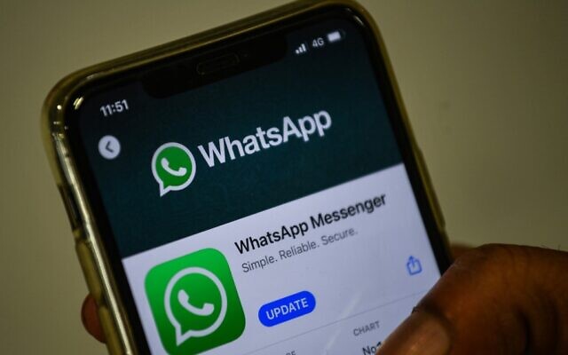 In this file photo taken on November 6, 2020 a user updates Facebook's WhatsApp application on his mobile phone in Mumbai (Indranil MUKHERJEE / AFP) In this file photo taken on November 6, 2020 a user updates Facebook's WhatsApp application on his mobile phone in Mumbai (Indranil MUKHERJEE / AFP)