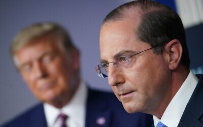 In this file photo Alex Azar, secretary of Health and Human Services (HHS), speaks as US President Donald Trump listens during an event on lowering prescription drug prices on November 20, 2020, in the Brady Briefing Room of the White House in Washington, DC (MANDEL NGAN / AFP)