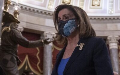 US House Speaker Nancy Pelosi walks through the Capitol in Washington on January 12, 2021. (Andrew Caballero-Reynolds/AFP)