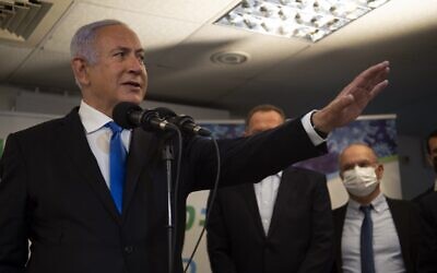 Prime Minister Benjamin Netanyahu visits a coronavirus vaccination facility in the northern Arab city of Nazareth on January 13, 2021. (Gil Eliyahu/POOL/AFP)