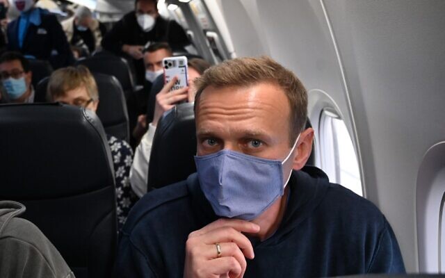 Russian opposition leader Alexei Navalny sits in a Pobeda airlines plane heading to Moscow before take-off from Berlin Brandenburg Airport (BER) in Schoenefeld, southeast of Berlin, on January 17, 2021. (Photo by Kirill KUDRYAVTSEV / AFP) Russian opposition leader Alexei Navalny sits in a Pobeda airlines plane heading to Moscow before take-off from Berlin Brandenburg Airport (BER) in Schoenefeld, southeast of Berlin, on January 17, 2021. (Photo by Kirill KUDRYAVTSEV / AFP)