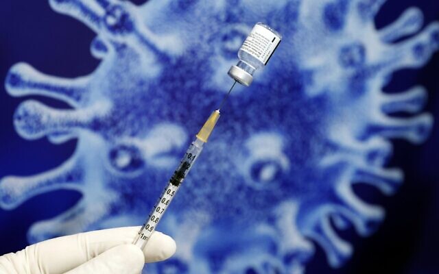 An Israeli health worker prepares a dose of the Pfizer-BioNtech coronavirus vaccine at Netanya stadium on January 20, 2021, in the coastal city of Netanya. (Jack Guez/AFP) An Israeli health worker prepares a dose of the Pfizer-BioNtech coronavirus vaccine at Netanya stadium on January 20, 2021, in the coastal city of Netanya. (Jack Guez/AFP)
