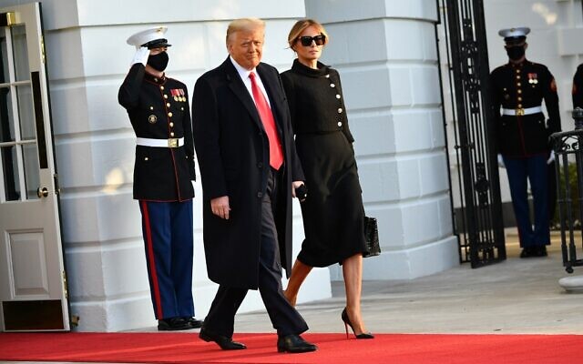 US President Donald Trump and First Lady Melania make their way to board Marine One before departing from the South Lawn of the White House in Washington, DC on January 20, 2021 (MANDEL NGAN / AFP) US President Donald Trump and First Lady Melania make their way to board Marine One before departing from the South Lawn of the White House in Washington, DC on January 20, 2021 (MANDEL NGAN / AFP)