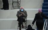 Former presidential candidate, Senator Bernie Sanders (D-Vermont) sits in the bleachers on Capitol Hill before Joe Biden is sworn in as the 46th US President on January 20, 2021, at the US Capitol in Washington, DC. (Photo by Brendan SMIALOWSKI / AFP)